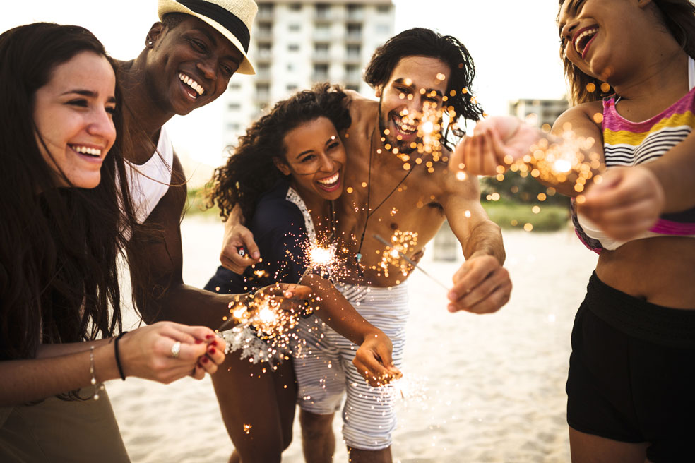 people-celebrating-the-new-year-on-the-beach-with-sparkler-000082175093_Medium.jpg